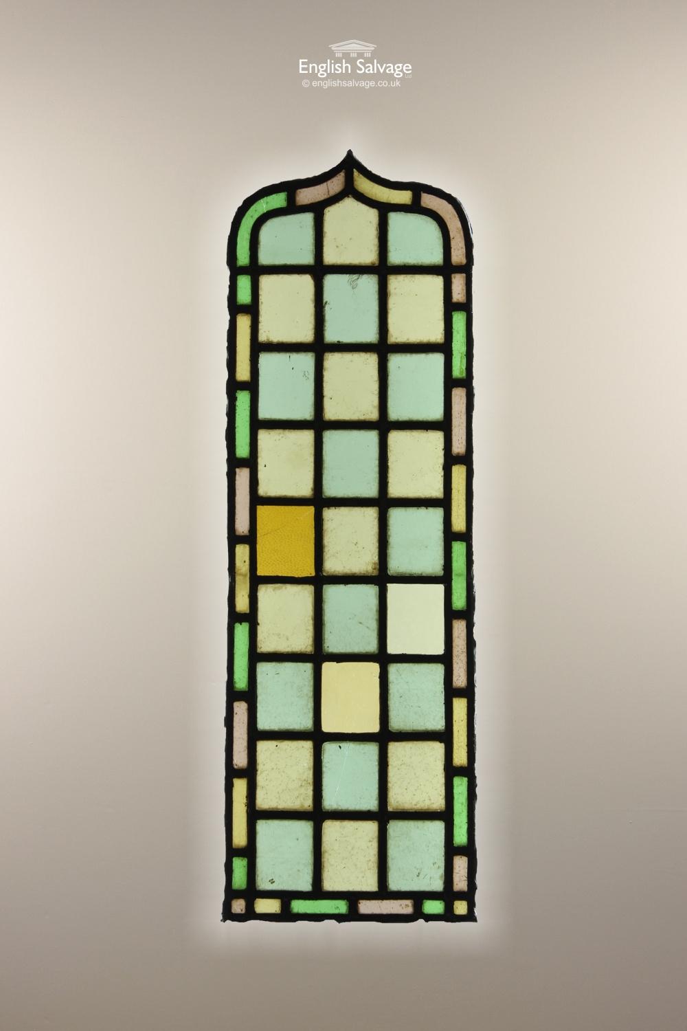 Reclaimed colorful stained glass lead panels. The shaped arch pieces come in two sizes:- a) three panes across plus edging = 28.6cm wide, 89.5cm high and b) two panes across plus edging = 25.8cm wide x 95.5cm. 

Various chips, cracks.