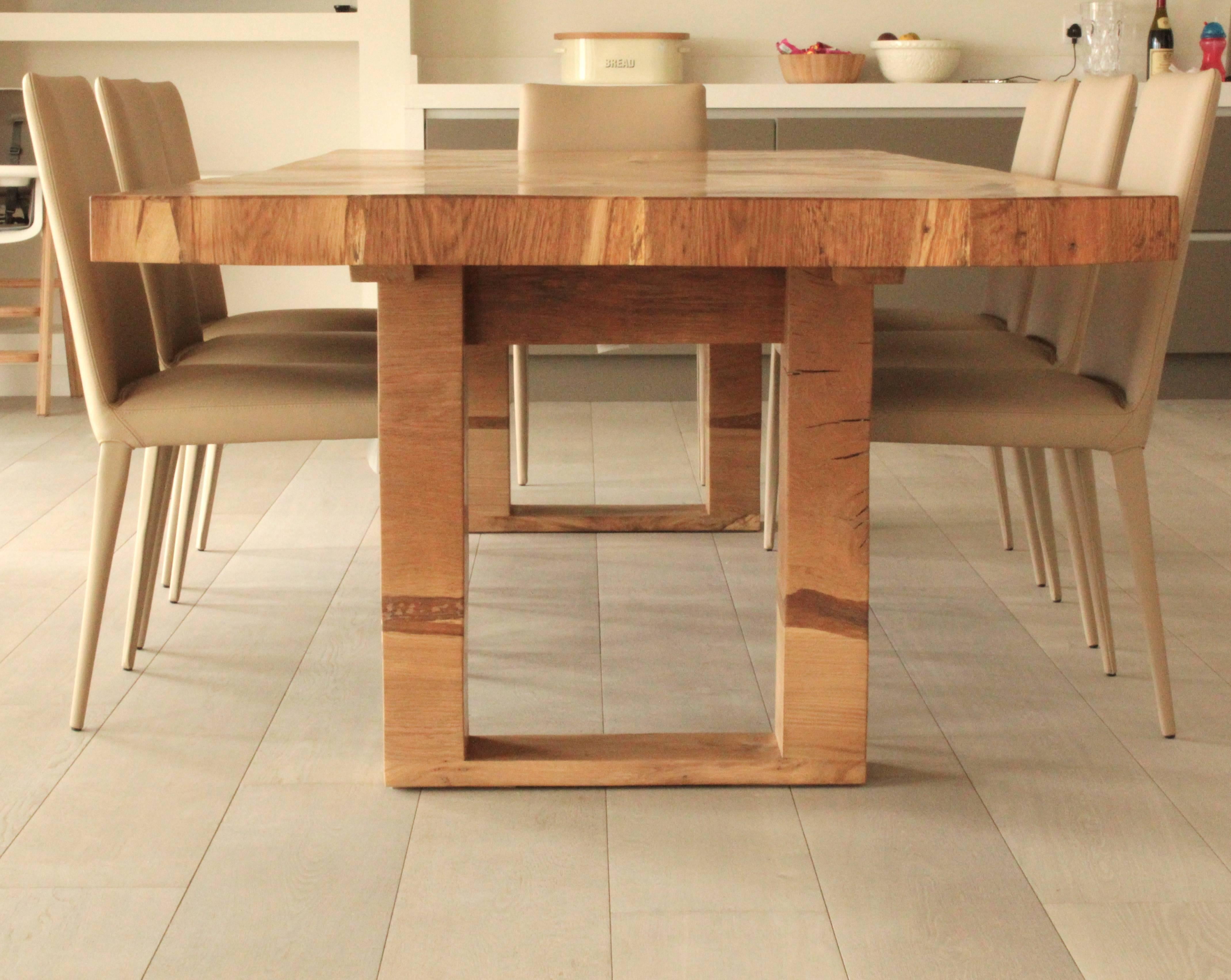 English oak dining table commissioned for a private client's lakeside house in the Cotswolds, England. Made from several slabs of live edge oak, the timber grain and figure is different for each tabletop.
The natural shapes and patterns of the live