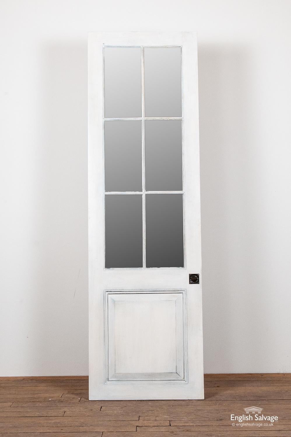 White mirrored pine single door, one of a set of bespoke, handmade, quality doors reclaimed from the same property. Handle to the centre. Beaded lower panel. The mirrored glass has a pleasing antique finish with foxing marks and spots. Last photo