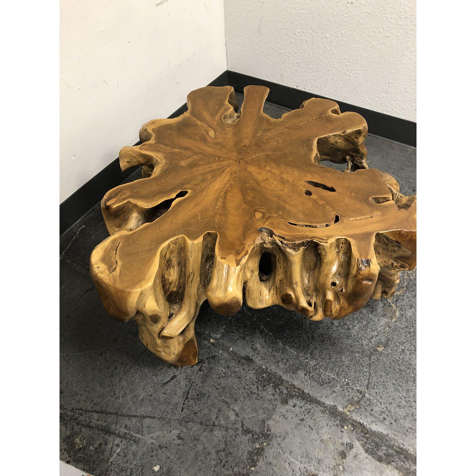 A salvaged teak root coffee table. Handcrafted from salvaged wood from Indonesia. Dug up from the ground, this beauty has been polished and given a clear natural finish. Bring this natural earth element into your space.
 
