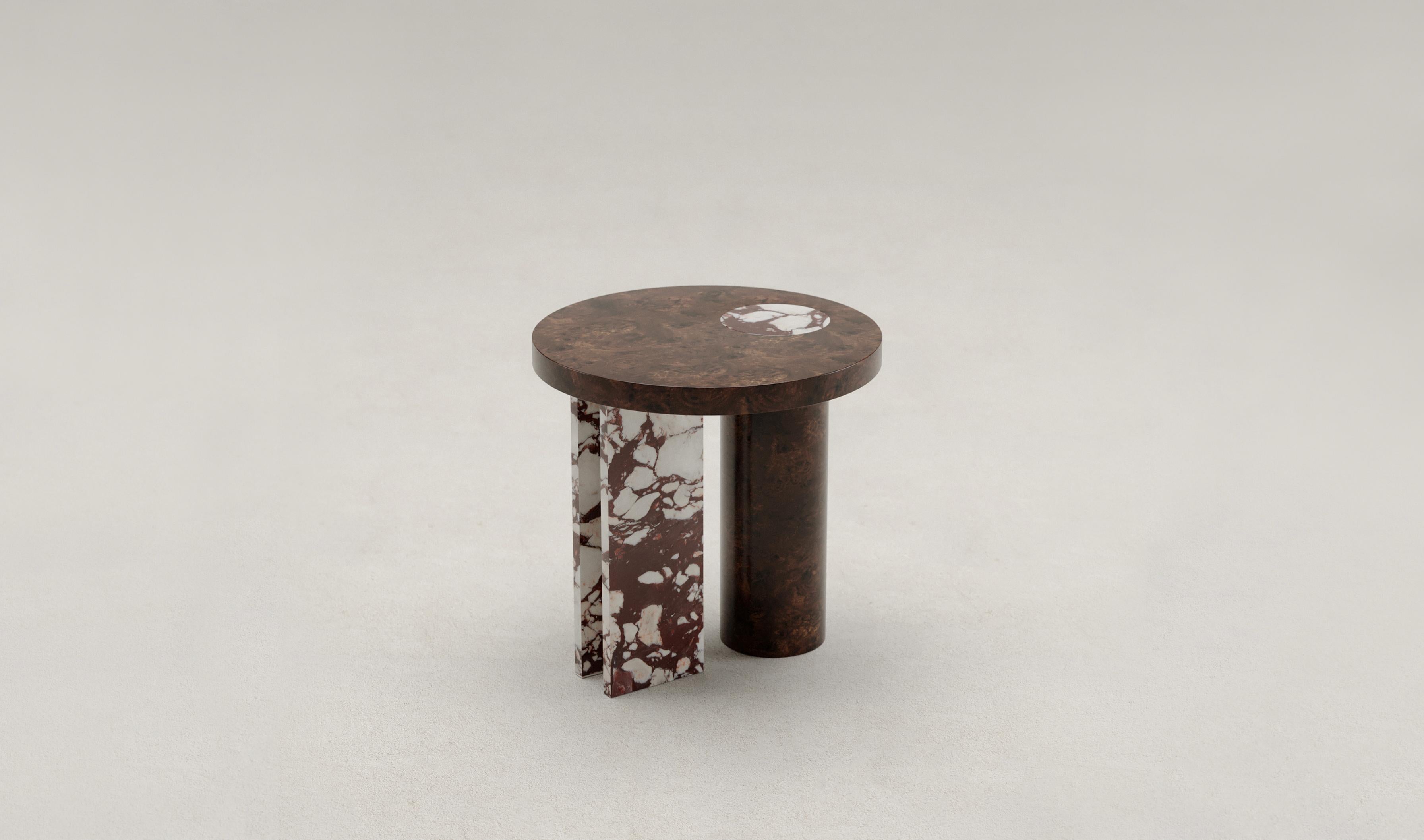 Salvante S1 side table by Piotr Dabrowa
Unique Piece
Dimensions: D 50 x H 50 cm
Materials: Calacatta Viola marble, walnut burl.
Also available: Botticino marble, Rosa Peralba marble.

Salvante table collection is a play between shapes,