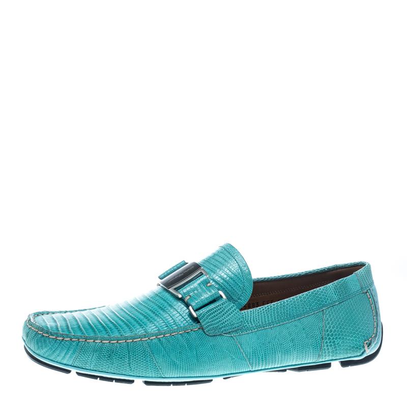 These aqua green loafers from Salvatore Ferragamo are not only high on appeal but also very skilfully made. They have been crafted from lizard leather in Italy and designed with beauty using neat stitching and signature buckle detailing on the