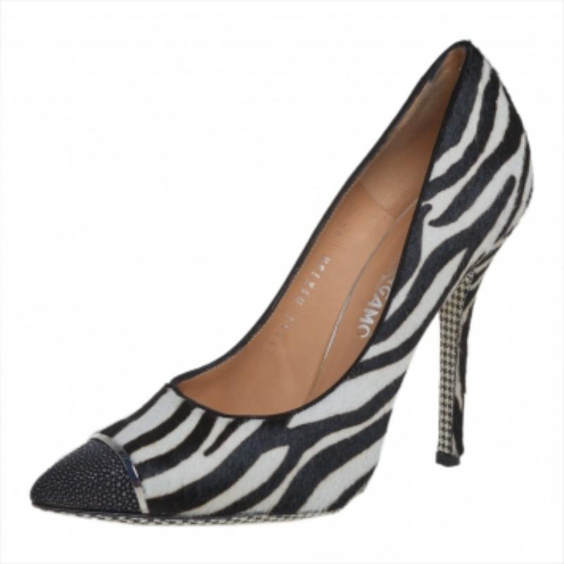 Stand out from a crowd with this gorgeous pair of Salvatore Ferragamo pumps that exude high fashion with class! Crafted from zebra-printed calf hair, this creation features stingray leather pointed toes, leather insoles, and stiletto heels. NOTE: