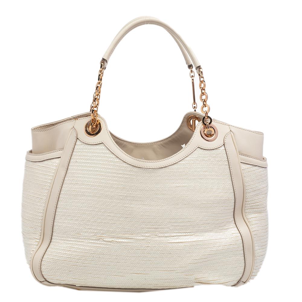 This super-stylish Betulla tote by Salvatore Ferragamo will reinvent your entire look. It is made with beige leather, has a fabric-lined interior, and is equipped with gold-toned hardware. In addition, this tote contains protective metal feet. Carry