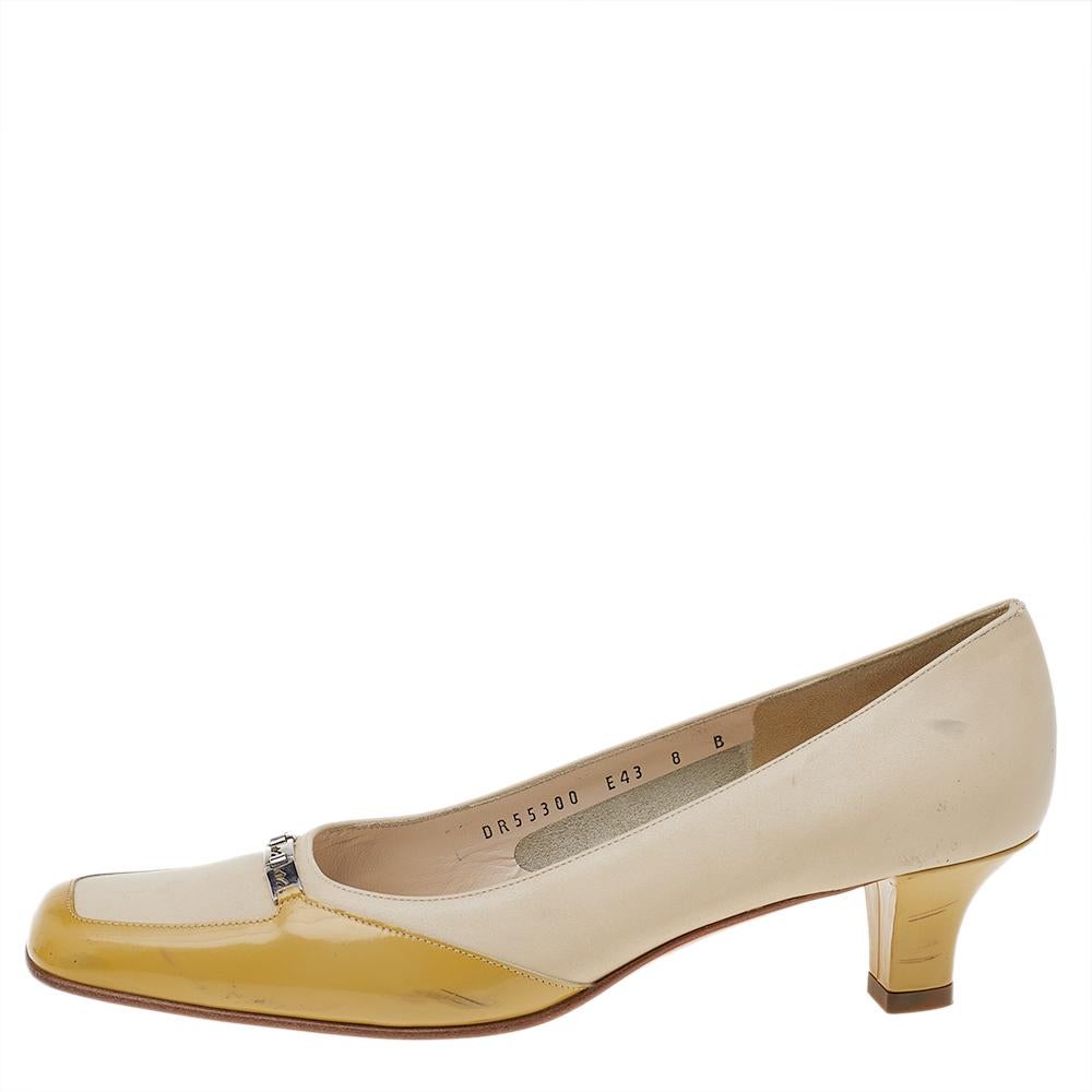 Salvatore Ferragamo brings forth this pair of pumps to add a touch of feminine grace to your wardrobe. Crafted using patent and leather, these pumps feature chic block heels that impart comfort to the look while the silver-tone logo at the vamps