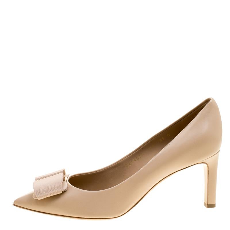Crafted using classy beige shaded leather, these pair o pumps from the house of Salvatore Ferragamo are designed to reflect a look of luxurious panache. Featuring a pointy-toed look that is enhanced with a bow embellishment, these shoes can be