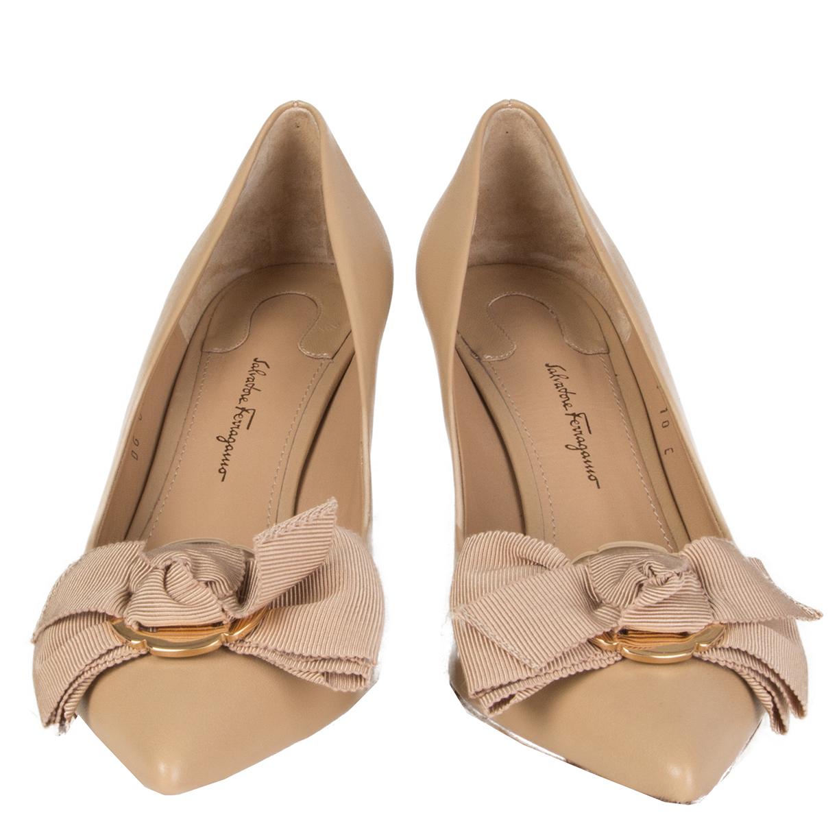 100% authentic Salvatore Ferragamo 'Talla' pointed-toe pumps in beige calfskin featuring grosgrain bow's with gold-tone hardware. Brand new. 

Measurements
Imprinted Size	10
Shoe Size	40
Inside Sole	27cm (10.5in)
Width	8cm (3.1in)
Heel	8cm