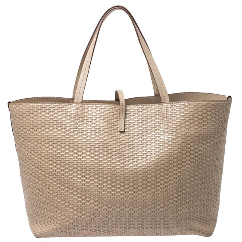 Highly durable and extremely fashionable, the Bice tote is woven from leather. The fabulous interior is lined with leather and offers ample room for all your essentials. Detailed with gold-tone hardware, it is equipped with two top handles. Made by