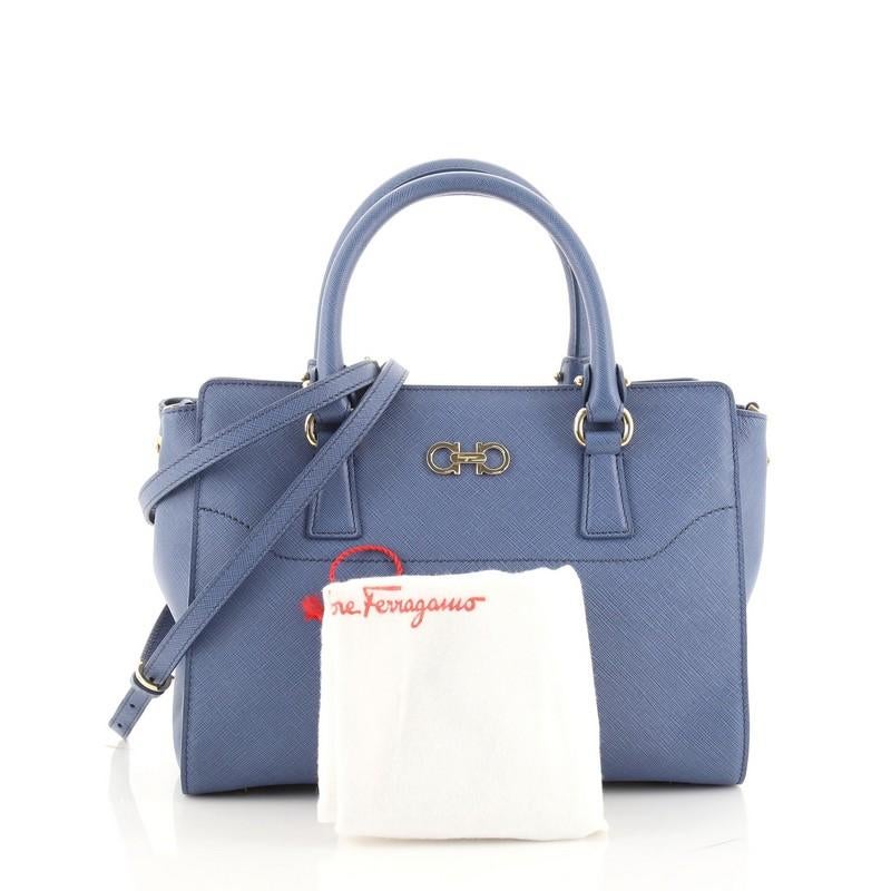Condition: Very good. Odor in interior. Light wear on base corners, creasing on exterior and strap, minor wear and small marks in interior. Loose stitching on interior pocket opening corner, scratches and slight discoloration on