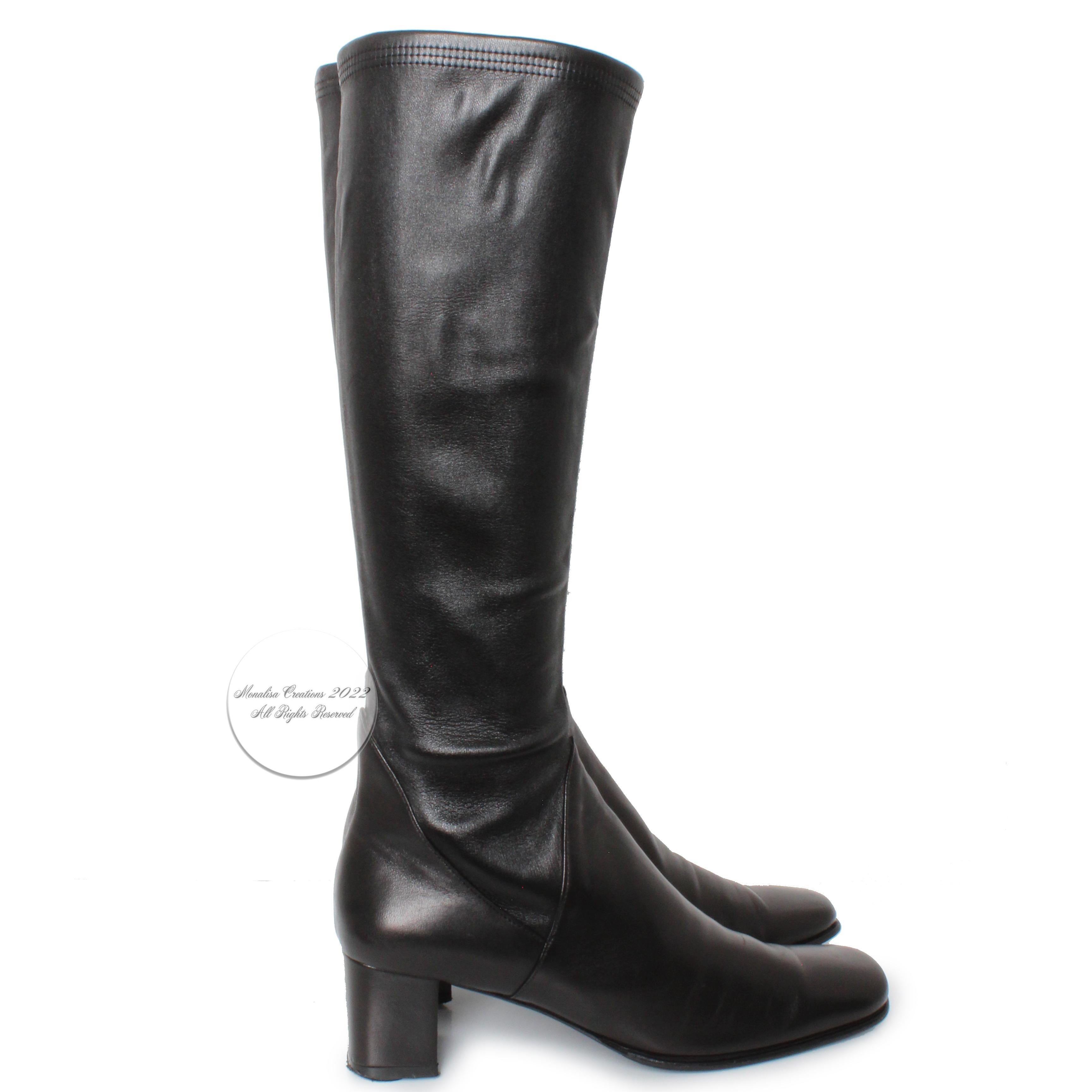 Salvatore Ferragamo black leather boots with stretch calves, likely made in the 90s.  Classic block heel boots that are easy to style and comfortable to wear!  The size stamp is faded on these boots, however we believe they are a size 8.