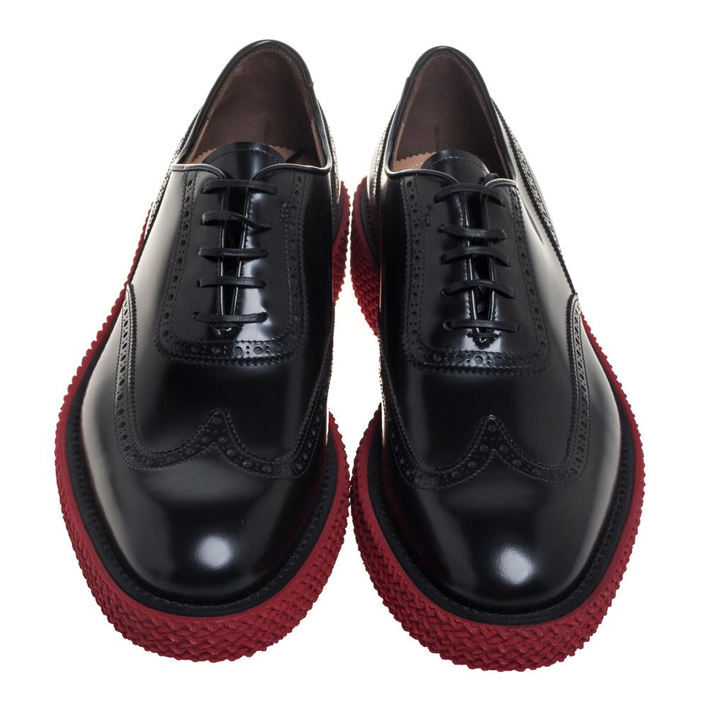 Check out this pair of black Salvatore Ferragamo oxfords and you'd want to buy them right away! They have been crafted from brogue leather and styled with round toes and lace-ups on the vamps. They come equipped with comfortable leather insoles and