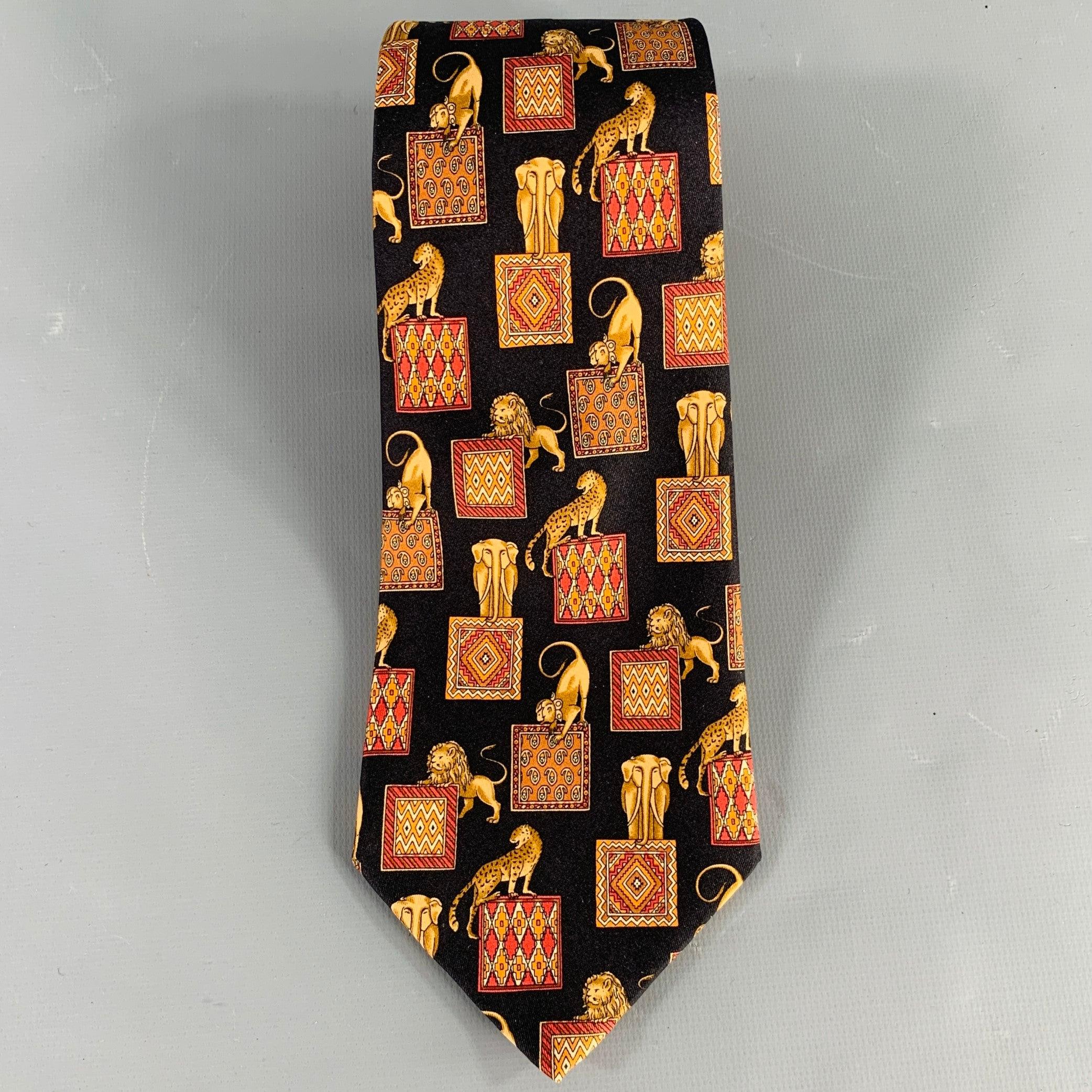 SALVATORE FERRAGAMO necktie in a black silk featuring a gold tone and burgundy animals with squares pattern. Made in Italy.Excellent Pre-Owned Condition. 

Measurements: 
  Width: 3.5 inches Length: 58 inches  
  
  
 
Sui Generis Reference: