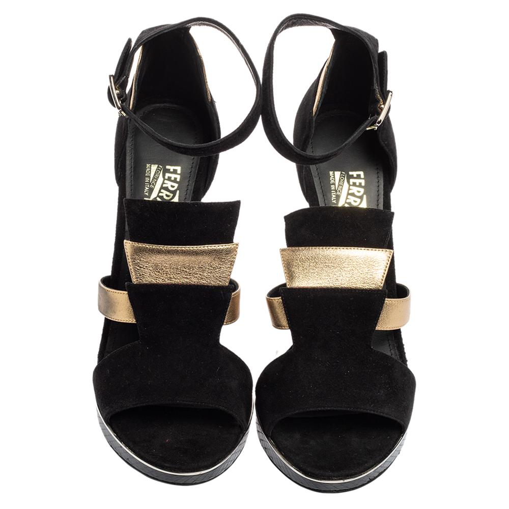 Add the right slant of style with these Salvatore Ferragamo sandals. The designer shoes in black suede and gold leather feature open toes, ankle strap closure, and statement heels for a comfortable lift.

Includes: Original Dustbag, Original Box,