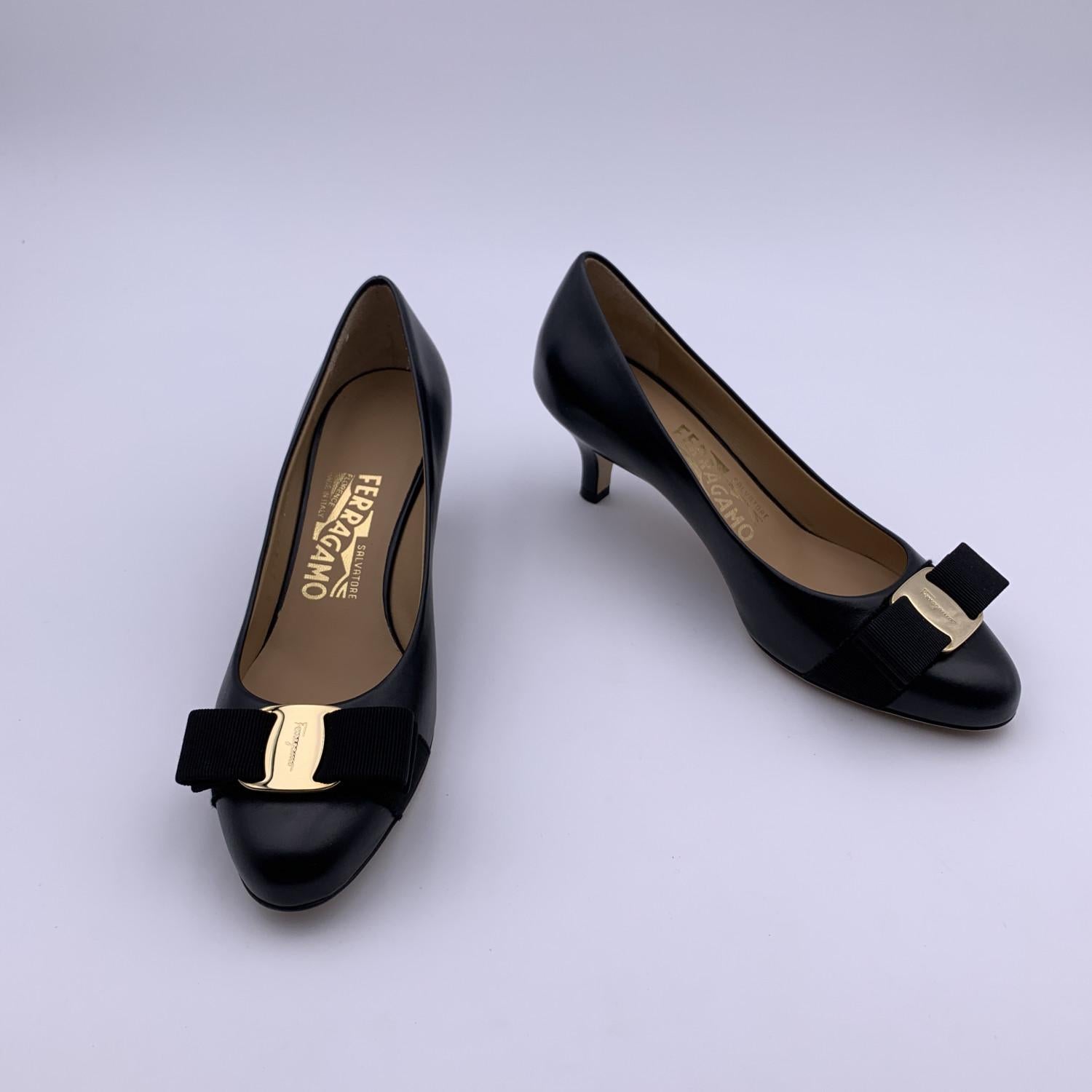 Classic Salvatore Ferragamo 'Carla' pumps . Crafted in black leather. They feature a round toe, Vara-bow detailing and covered heels. Heels height: 2.25 inches - 5.5 cm - . Leather outsole. Made in Italy. Size: US 4.5 C - EU 35 C (The size shown for
