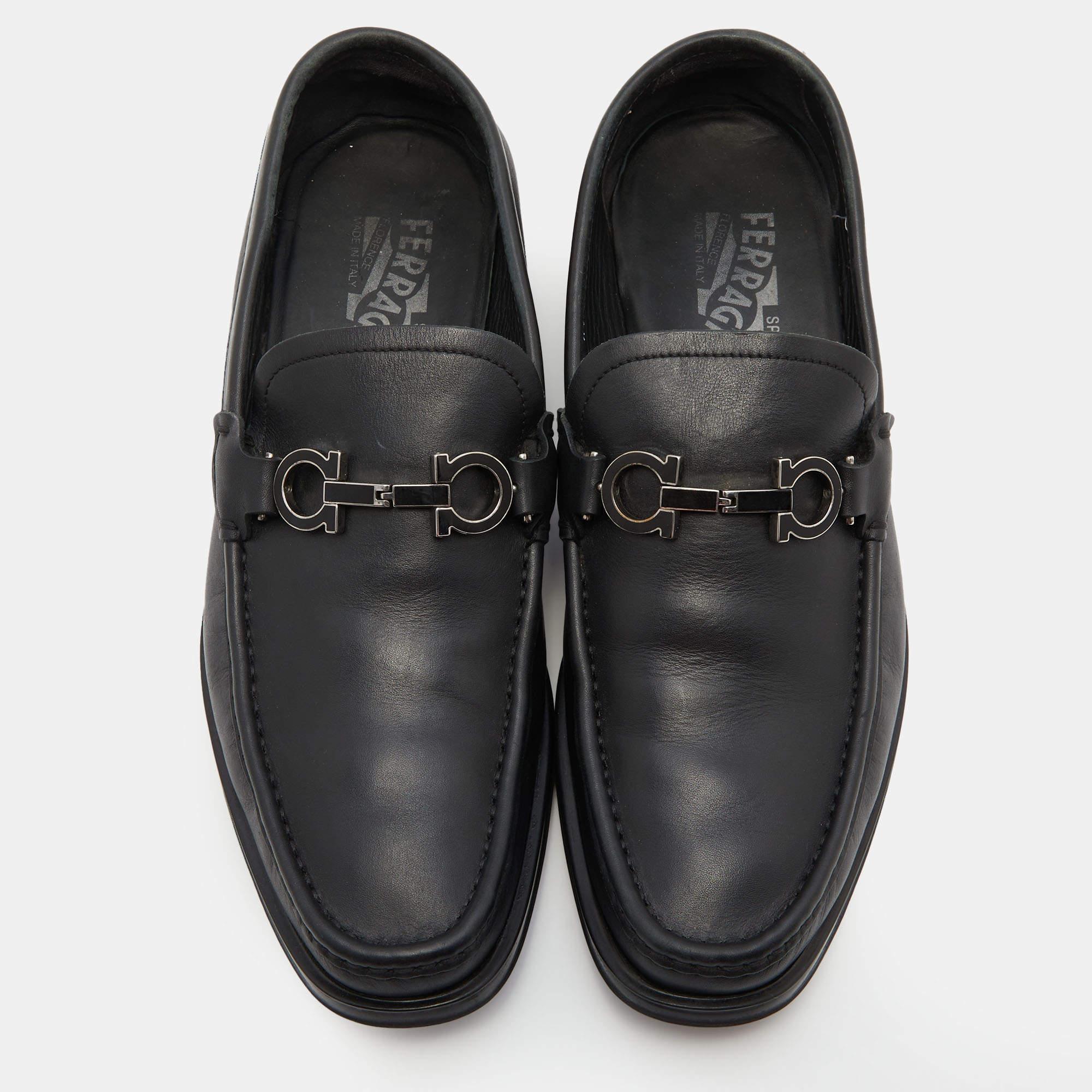 Walk in style and confidence as you wear these loafers from the House of Salvatore Ferragamo! They are designed using black leather, with a silver-toned Gancini Bit motif placed on the vamps. They flaunt an easy slip-on style. Comfortable and
