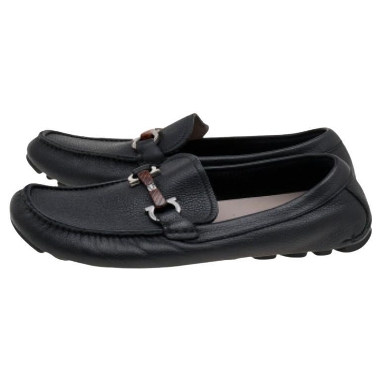 These loafers from Salvatore Ferragamo will grant your feet complete comfort and luxury! They are created using black leather, with a Gancini Bit embellishment on the vamps. They feature an easy slip-on style and silver-tone hardware. Complement
