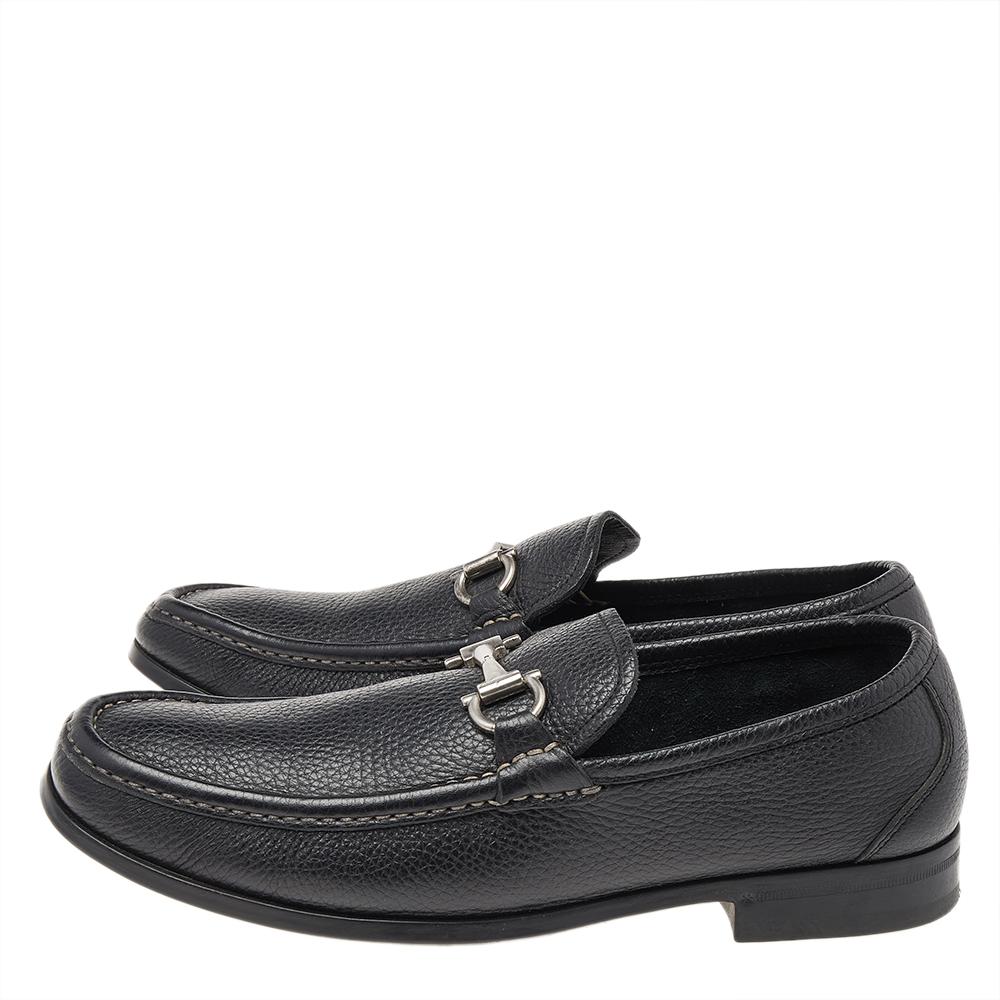 These black loafers from Salvatore Ferragamo are not only high on appeal but also very skillfully made. They have been crafted from quality leather in Italy and designed with beauty using neat stitching and the Gancini logo on the uppers. The
