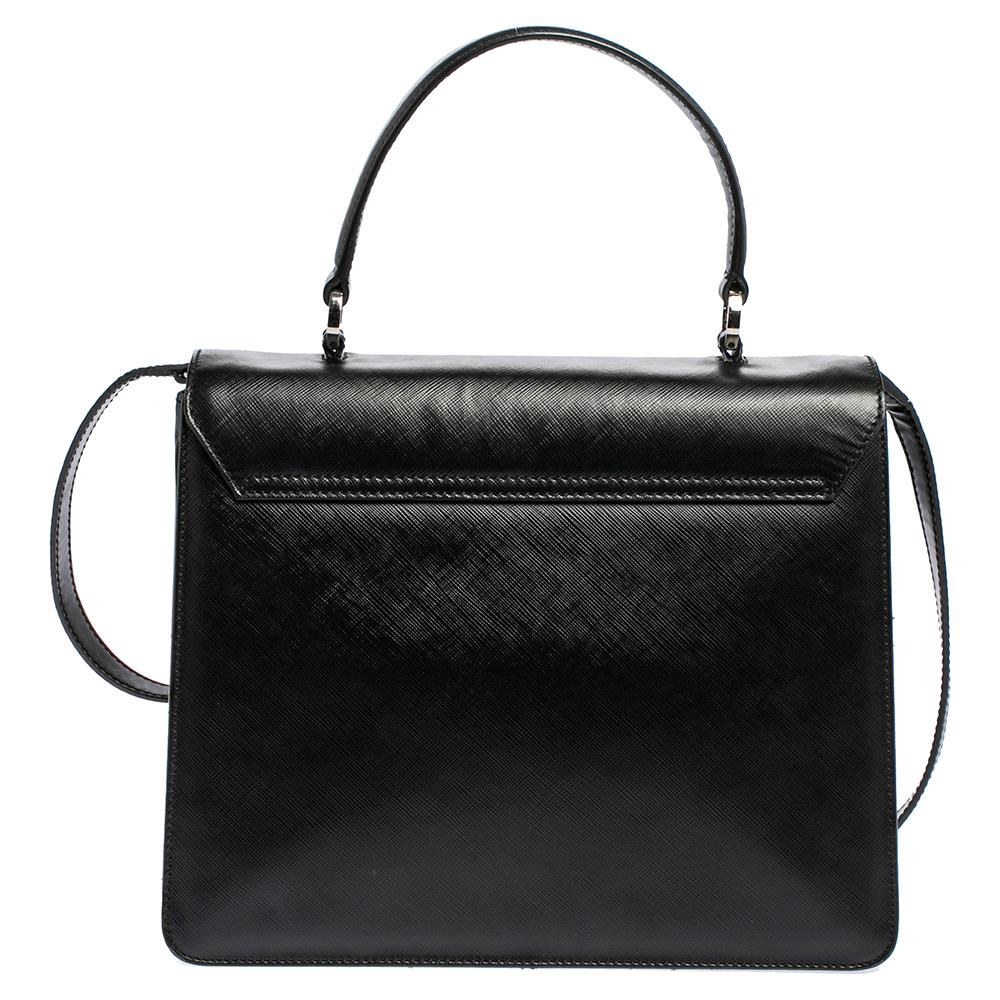 This Salvatore Ferragamo top handle bag is the perfect accessory to spice up any outfit and leave you looking and feeling your most confident and fashionable self. Crafted from black leather, this Gancio flap bag is a must-have for the fashionista