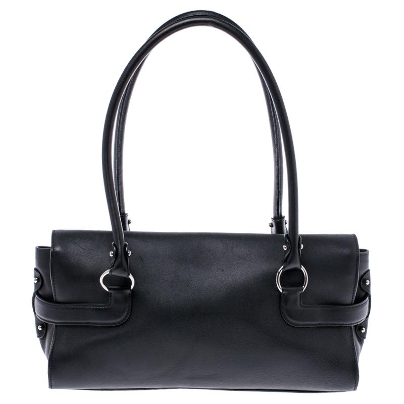 This stunning satchel by Salvatore Ferragamo is a must-have. It is gorgeous enough to upgrade any look. This classy bag has a lovely leather exterior and an equally beautiful interior lined with canvas. It features dual handles and silver-tone