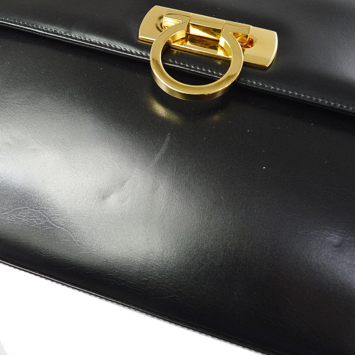 Salvatore Ferragamo Black Leather Gold Gancini 2 in 1 Clutch Shoulder Chain Flap Bag

Leather
Gold tone hardware
Leather lining
Turnlock closure
Made in Italy
Shoulder strap drop 19