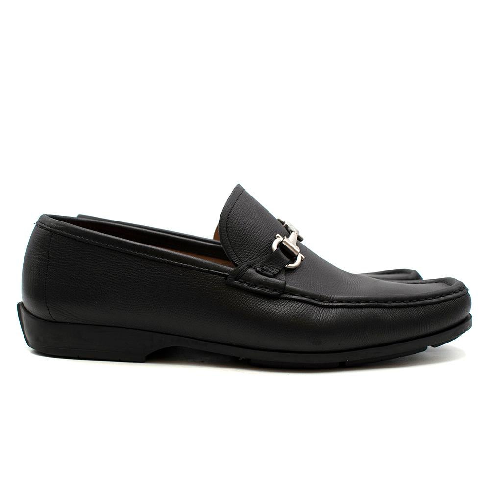 Salvatore Ferragamo Black Leather Horsebit Loafers

- Black embossed leather 
- Horsebit detail loafers 
- Square toe
- Slip on style 
- Low block heel 

Materials: 
Lining: Calf Leather 100%
Outer: Leather 100%
Sole: Leather 100%

Made in