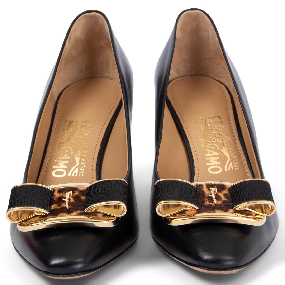 100% authentic Salvatore Ferragamo pumps in black smooth calfskin embellished with a gold-tone metal buckle in leopard-print calf-hair and black grosgrain. Have been worn once or twice and are in virtually new condition. 

Measurements
Imprinted