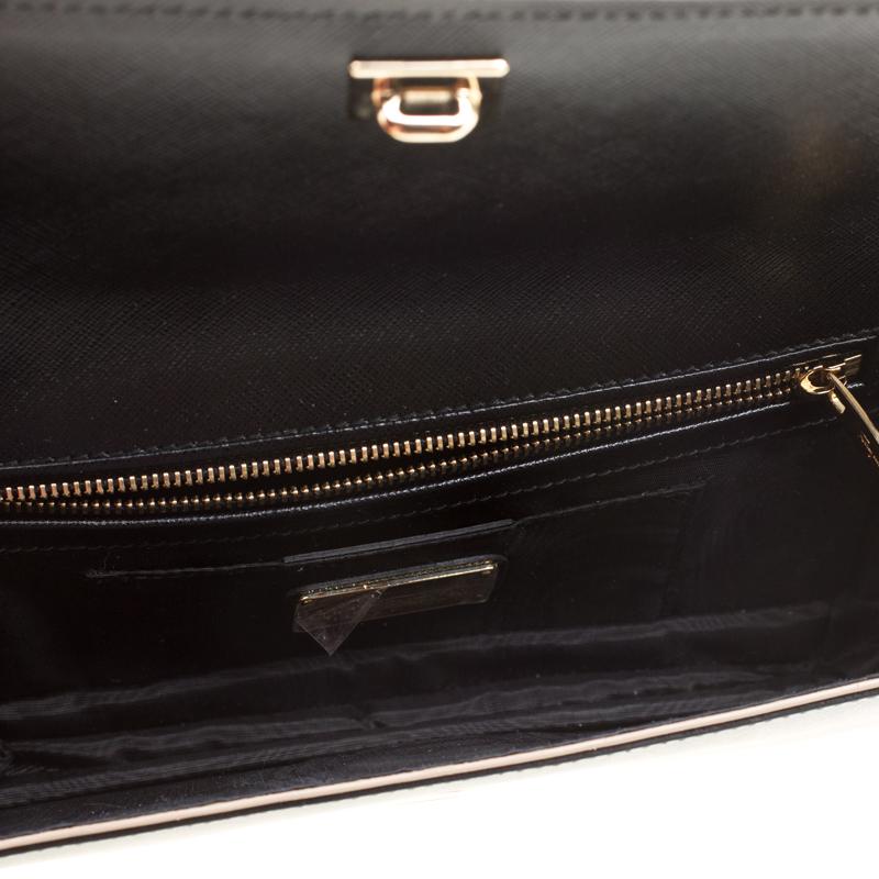 Salvatore Ferragamo the Italian fashion house brings you yet another gorgeous accessory with this clutch. It has been crafted from black leather and styled with a flap that holds the signature Vara bow. The insides are fabric-lined and the clutch