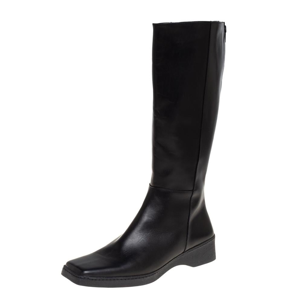 These mid-calf boots from Salvatore Ferragamo epitomize chic and effortless style. They come crafted from black leather and feature square toes. They are equipped with comfortable insoles, zippers on the counters, and durable rubber soles. They will