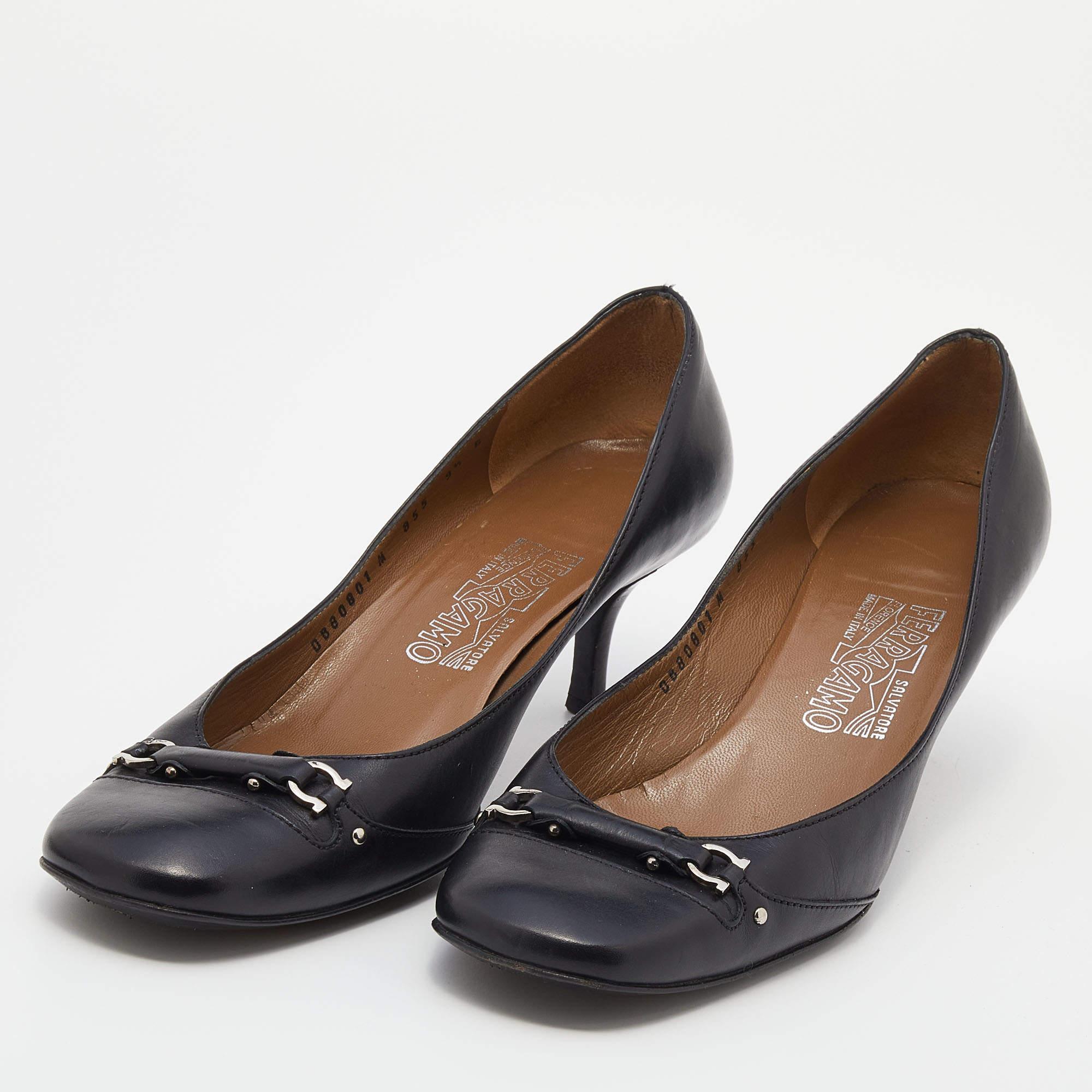 With its minimal design and classy appeal, this pair of Salvatore Ferragamo pumps deserve space in your closet. It is crafted from leather into a square toe silhouette and is adorned with a silver-tone motif on the front. The 10cm heels of these