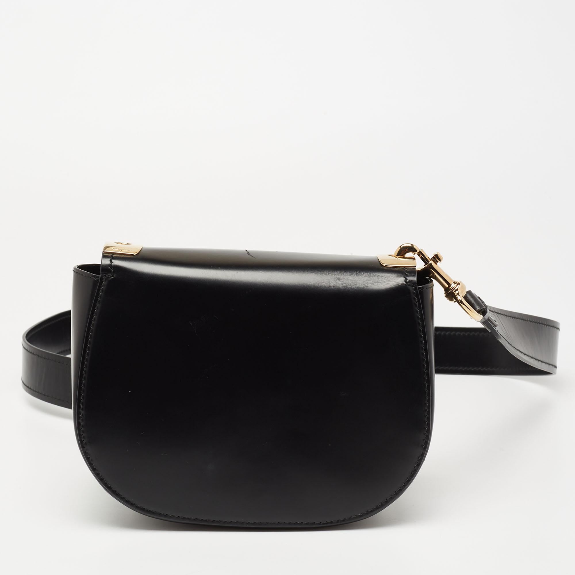 This shoulder bag from the House of Salvatore Ferragamo is both elegant and fashionable. Crafted from black leather, this bag features a shoulder strap, gold-tone hardware, and a leather-lined interior. A Vara Bow accent is placed on the front. Make