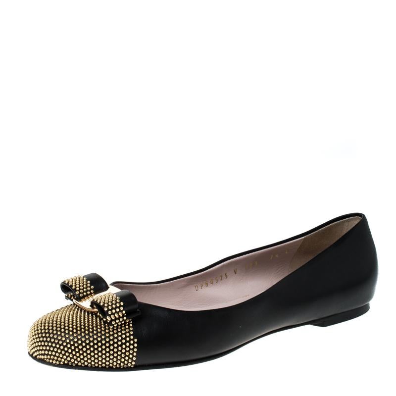 Fashion is the perfect blend of luxury with comfort, and this pair of ballet flats from the house of Salvatore Ferragamo exudes just that. Crafted from black leather and styled with their signature Varina bow and studs on the uppers, these flats are