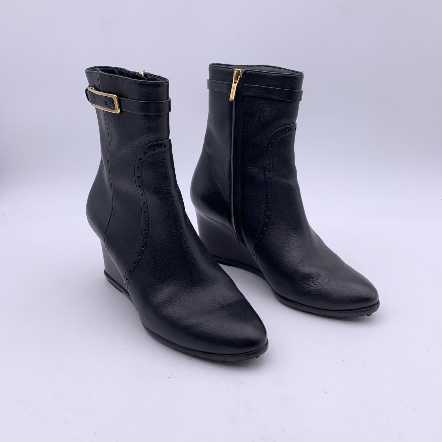 Salvatore Ferragamo black leather heeled ankle boots with wedges. Composition: Leather. Zip closure on the side. Almond toeline. Gold metal buckle detail. Leather outsole. Heels height: 3 inches - 7.6 cm . Size 6.5 C - 37 C

Details

MATERIAL: