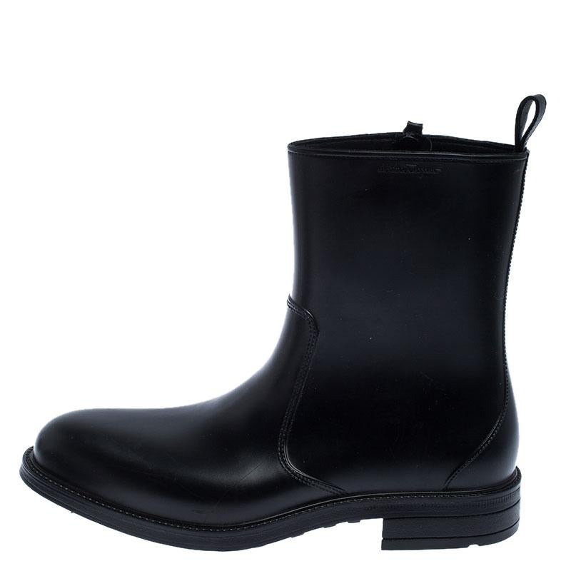 These boots from Salvatore Ferragamo are crafted in smooth black leather into a fashionable design. They feature round toes, side zippers, leather soles and low heels. The clean look offered by these boots will blend well with a variety of your