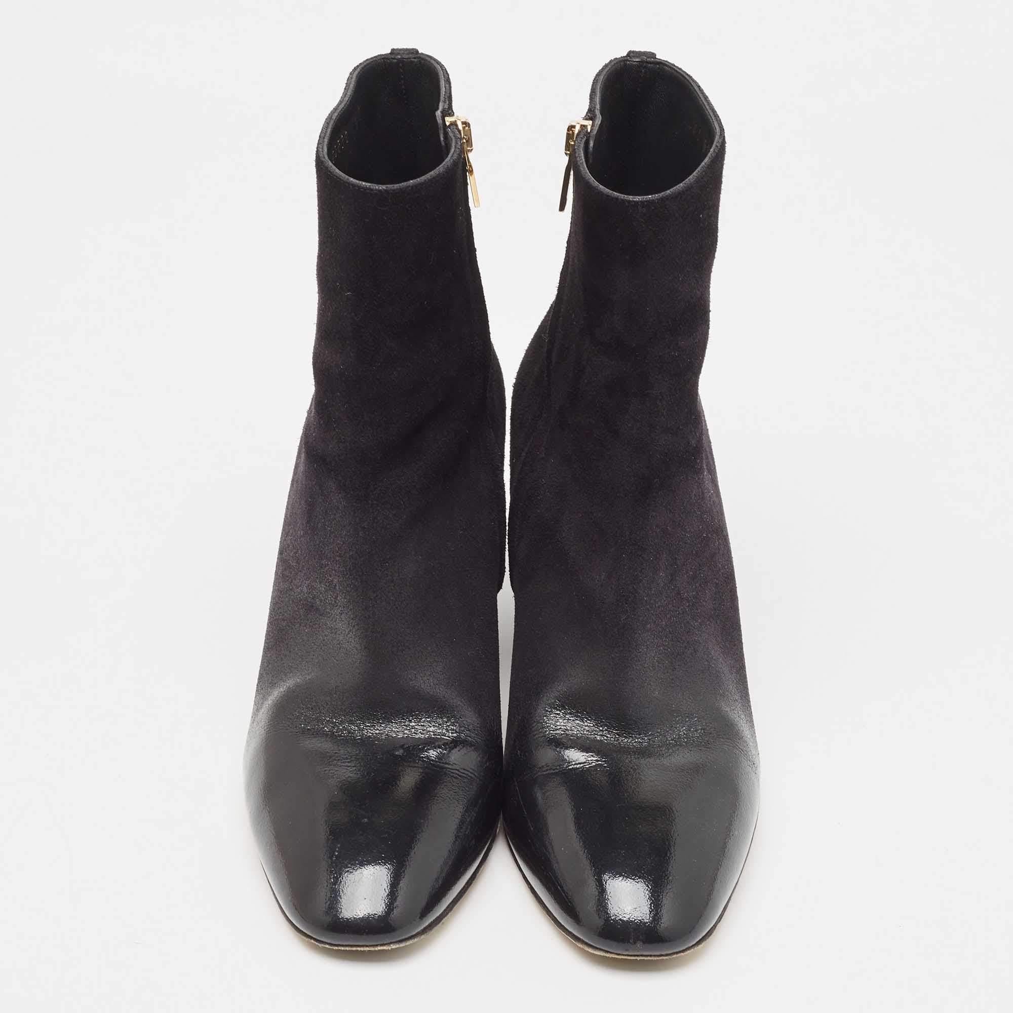 Give your outfit a chic update with this pair of Salvatore Ferragamo ankle boots. The creation is sewn perfectly using patent & leather and added with block heels. Make a statement in these!

Includes
Original Dustbag