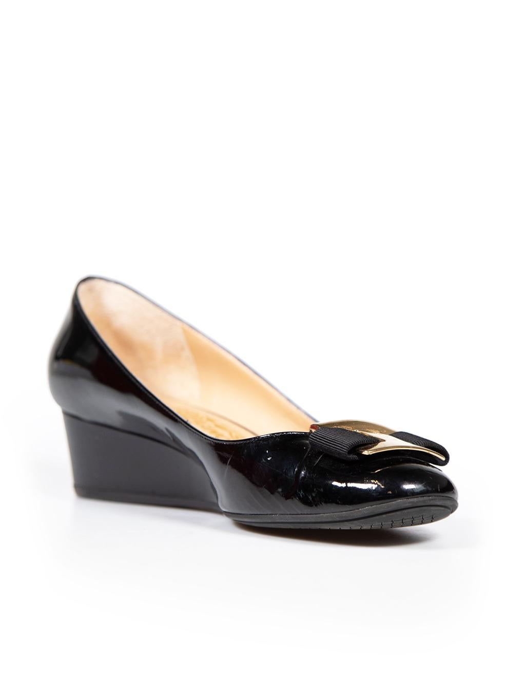 CONDITION is Very good. Minimal wear to shoes is evident. Minimal wear to the front hardware and sides is seen with abrasion marks and creasing of the leather in the front and on the insoles on this used Salvatore Ferragamo designer resale item.