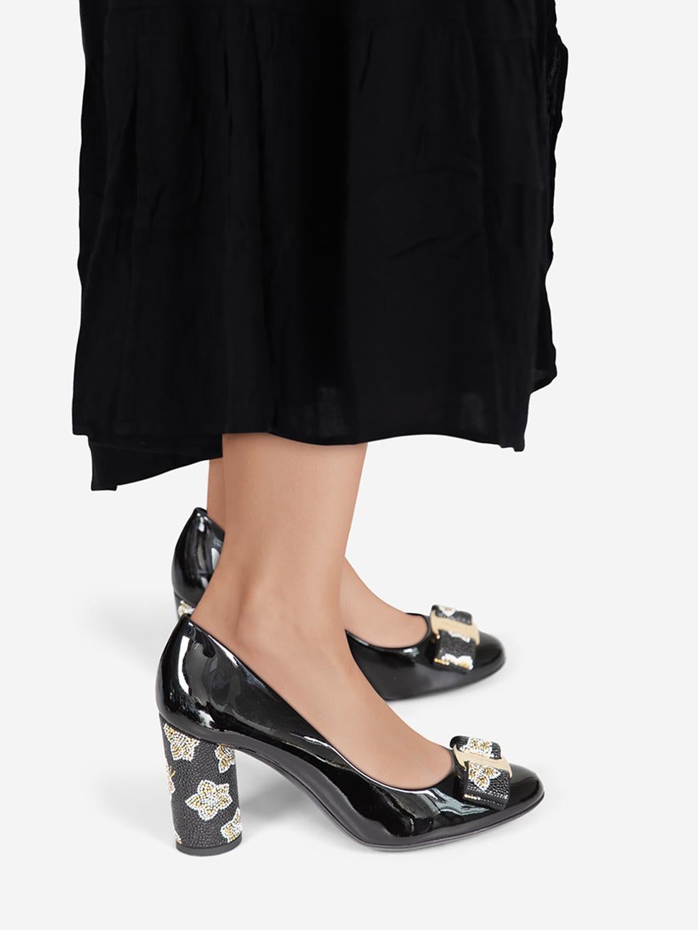 CONDITION is Very good. Minimal wear to the heels is evident. Abrasion on both sides of the left shoe and the left side of the right shoe on this used Salvatore Ferragamo designer resale item.
 
 Details
 
 
 Black
 
 Patent leather
 
 Pumps
 
