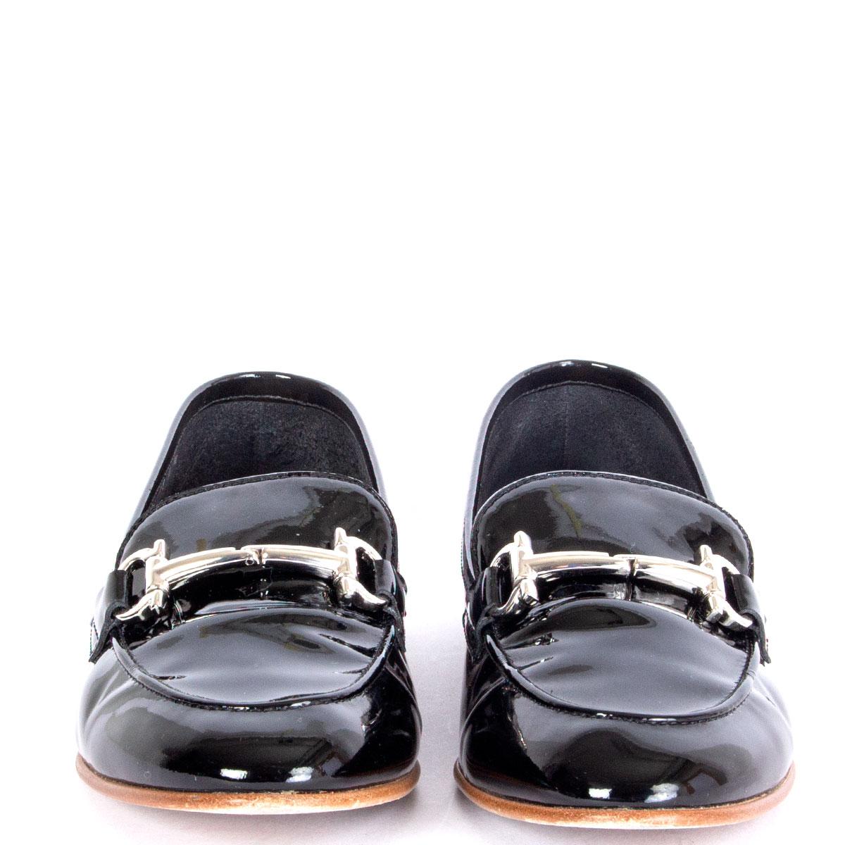 100% authentic Salvatore Ferragamo Informal patent leather black loafers featuring silver-tone horse-bit. Have been worn and are in excellent condition. 

Imprinted Size	37.5
Shoe Size	37.5
Inside Sole	24.5cm (9.6in)
Width	7.5cm (2.9in)
Heel	1cm