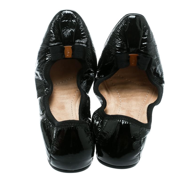 You would never want to take off these comfortable Salvatore Ferragamo ballet flats. They are crafted from black patent leather and designed with signature bows on the uppers and a scrunch style for a good fit.

Includes: Info Booklet, Branded Box

