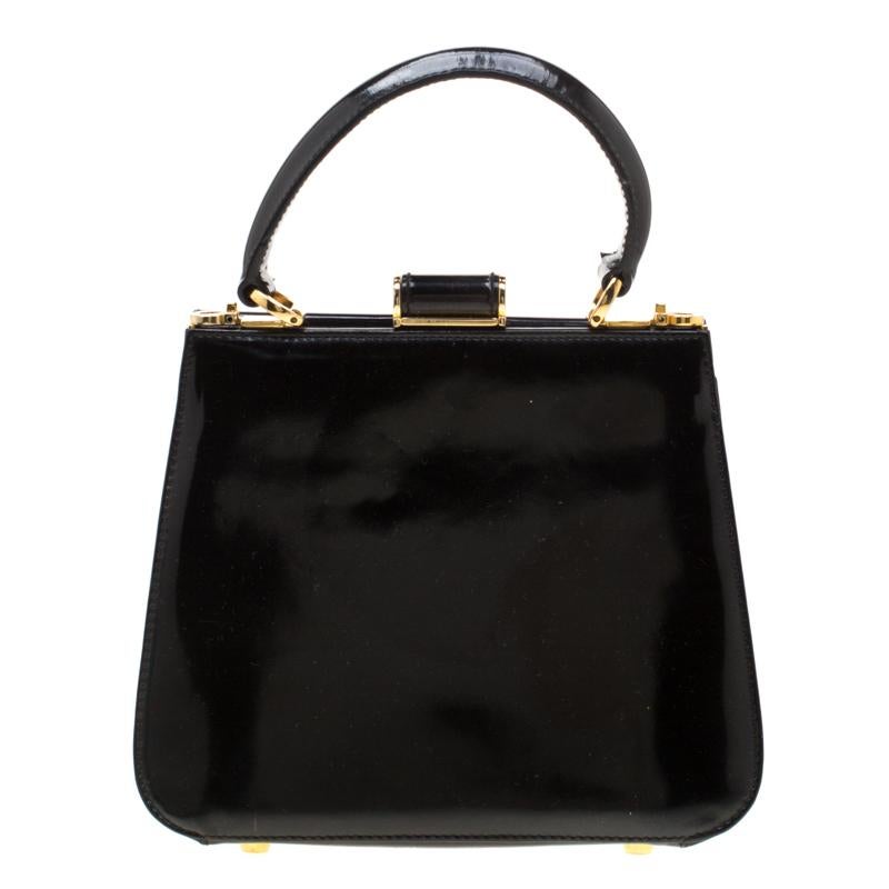 Salvatore Ferragamo brings you this carefully designed bag made from patent leather with love. This attractive and durable bag, with gold-tone metal inserts and a top handle, will surely not let you down. It comes in black with a well-sized fabric