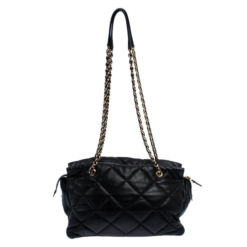When you need to add a beautiful and elegant bag to your evening look, this Ginette shoulder bag from Salvatore Ferragamo will look chic as well as hold your essentials comfortably. The bag is crafted from black quilted leather and features dual