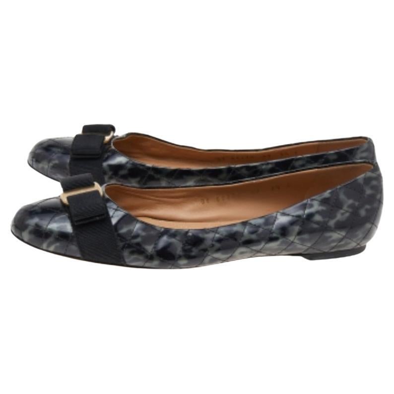 Keep your comfort at a maximum with these beautiful patent leather flats. Glam up your outfit with these quilted flats from the house of Salvatore Ferragamo. Stay comfortable through your day at work in these beautiful black flats.