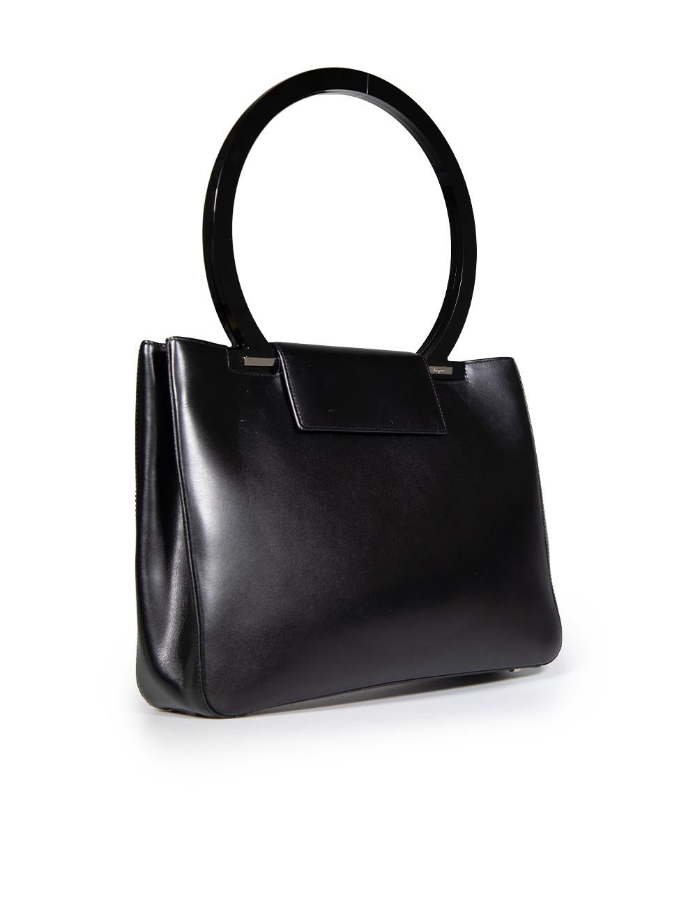 CONDITION is Good. General wear to the bag is evident. Abrasion and general creasing to the leather on the front, back, top flap closure and base. Scratching to both circular handles and the silver button closure. Small marks on the inside base of