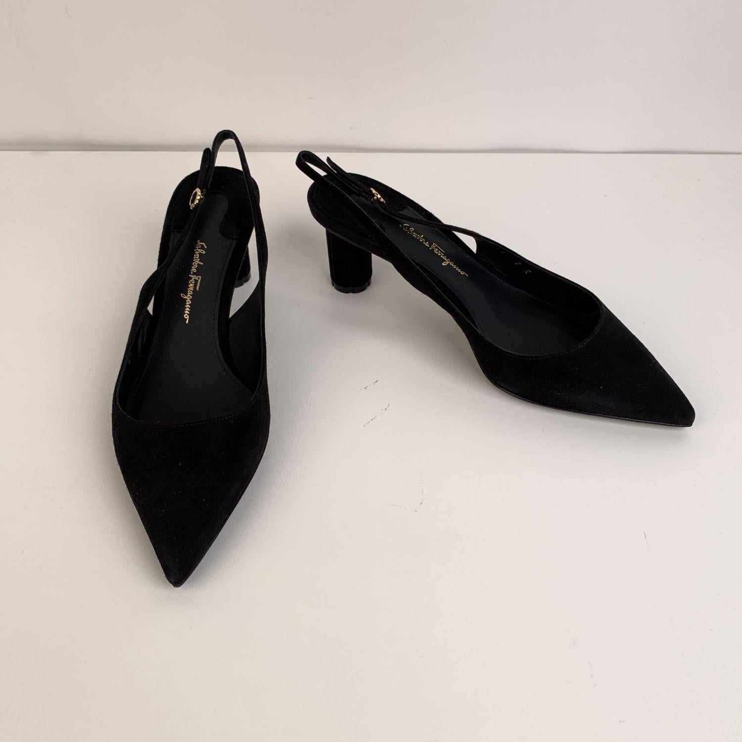 Beautiful Salvatore Ferragamo Buti 55 Slingback pumps. Crafted in black suede, they feature a pointed toe, adjustable ankle strap and block flower-shaped covered heel. Leather sole. Heels Height: 2.1 inches - 5.5 cm. Made in Italy. Size: US 7.5 C -