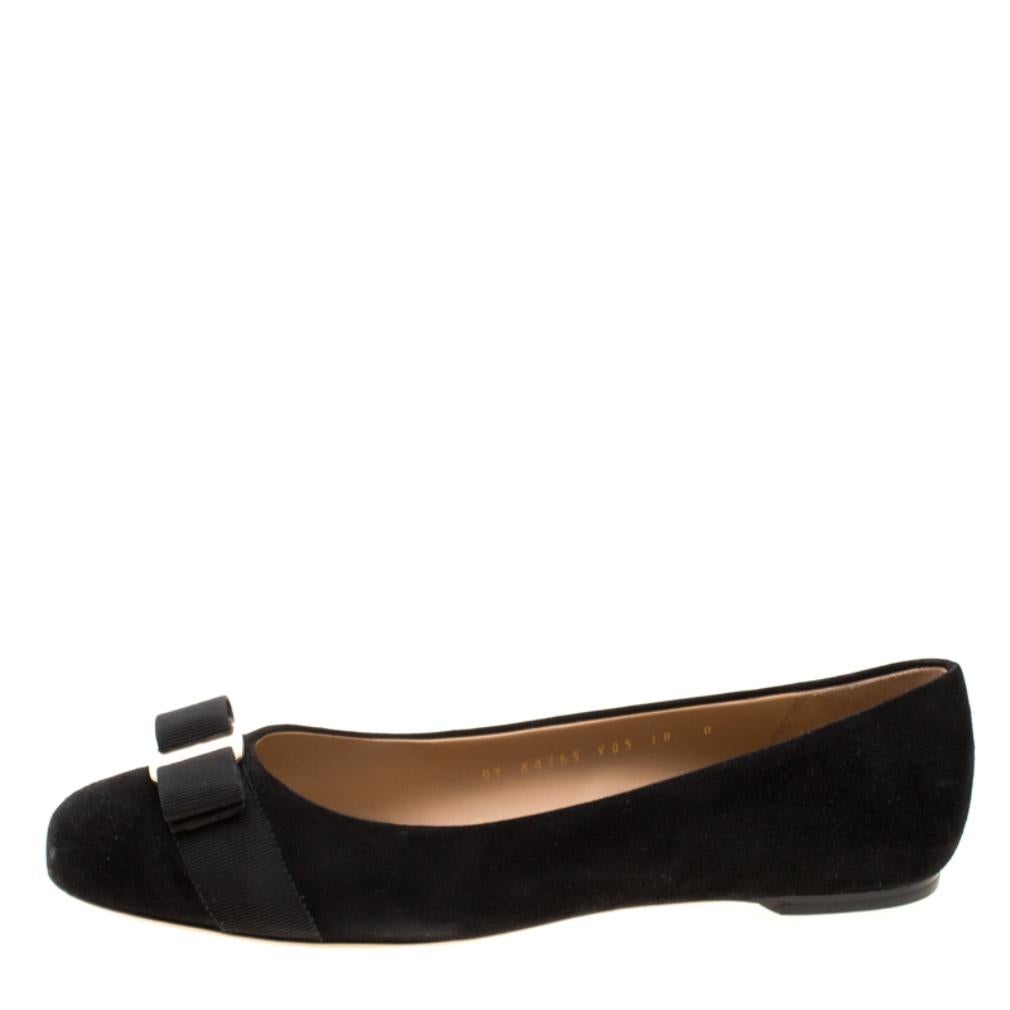 Fashion is the perfect blend of luxury with comfort, and this pair of ballet flats from the house of Ferragamo exudes just that. Crafted from smooth black suede and styled with their signature Varina bow on the uppers, these flats are ideal for