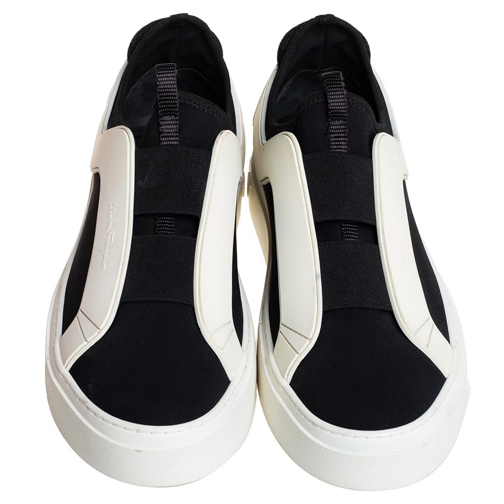 These Salvatore Ferragamo slip-on sneakers are the perfect everyday shoes. You can just slip them on and be sure that you will be comfortable. They feature white rubber trims on the fabric upper and elastic panels to make them easy to wear. They are