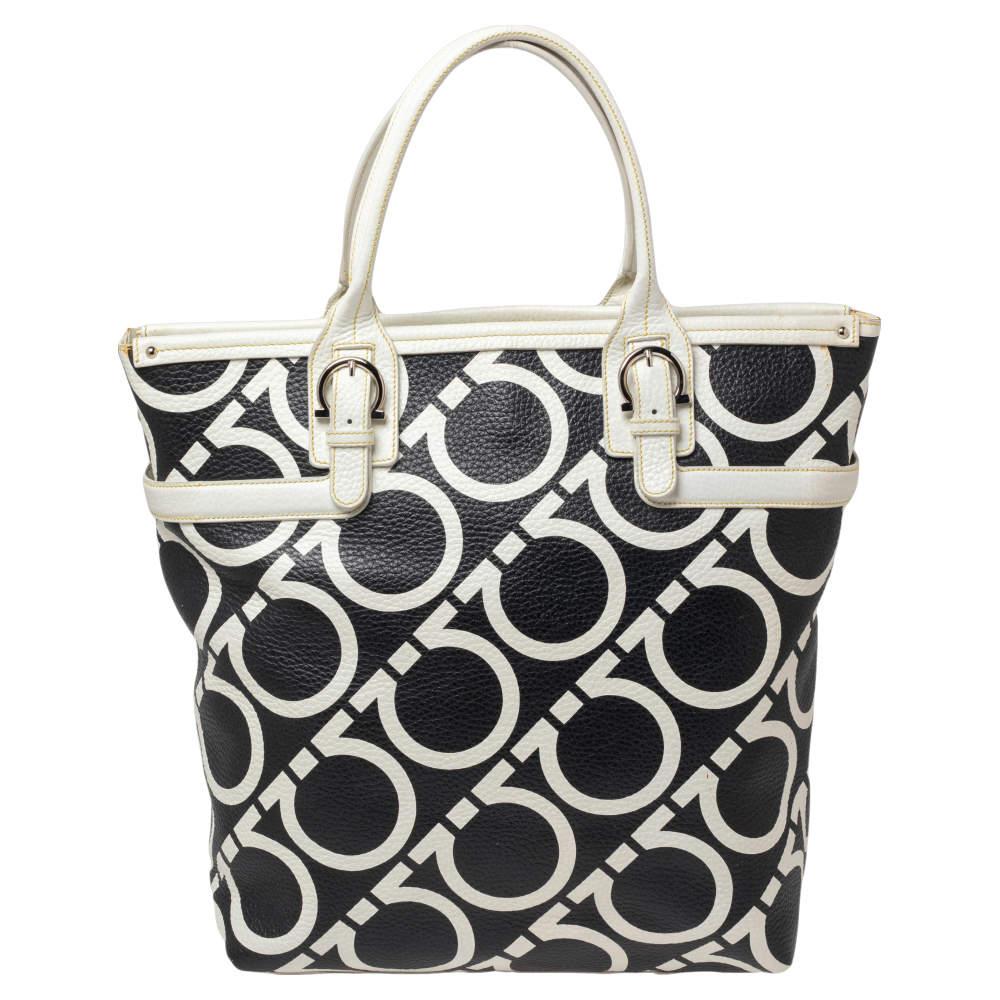 This Salvatore Ferragamo tote will help you put together an effortlessly stylish look. This gorgeous tote is grafted from Gancini print leather and held by dual handles and a shoulder strap. The interior is lined with fabric and secured by a zip