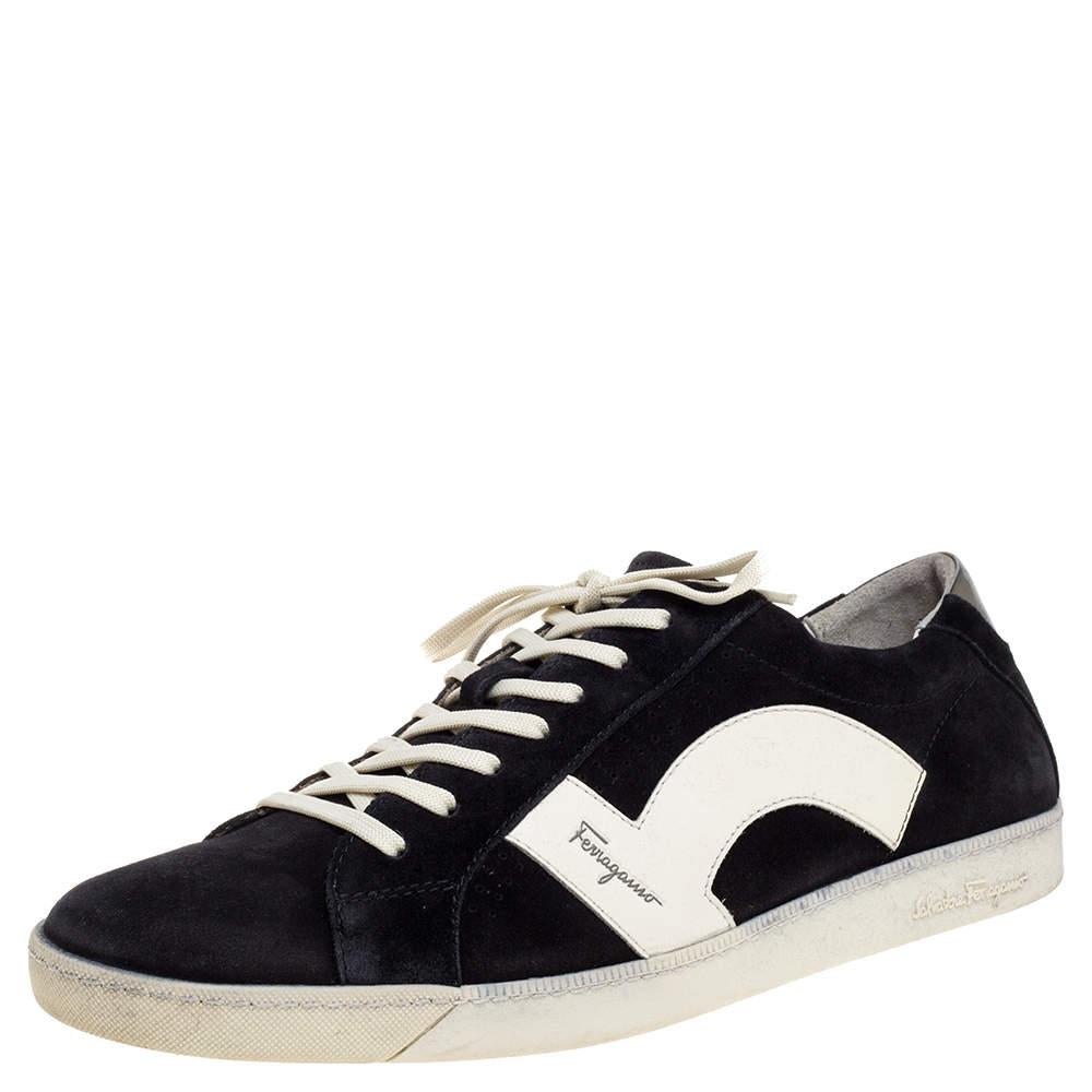 These effortlessly stylish sneakers from Salvatore Ferragamo are meant for sneaker lovers like you! They are crafted from black suede and white leather and designed with round toes, lace-ups on the vamps, and logo details on the sides and the