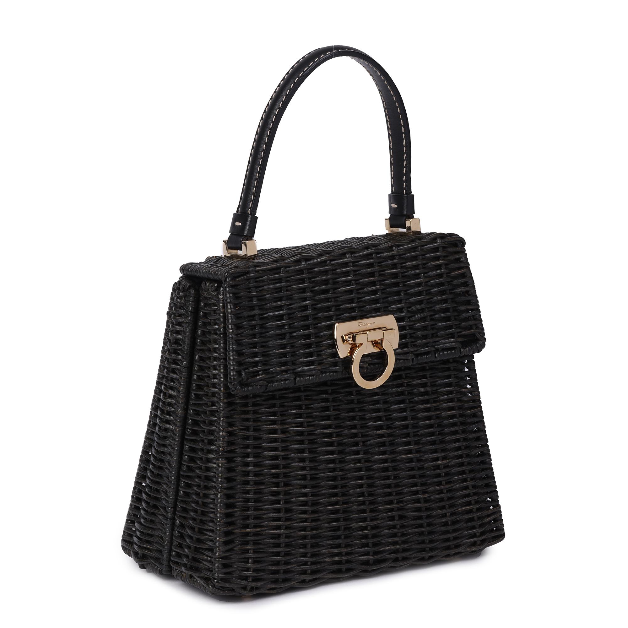 SALVATORE FERRAGAMO
Black Wicker & Calfskin Leather Vintage Gancini

Xupes Reference: JJLG067
Serial Number: DV-21 3403
Age (Circa): 1990
Accompanied By: Salvatore Ferragamo Dust Bag
Authenticity Details: Date Stamp (Made in Italy)
Gender: