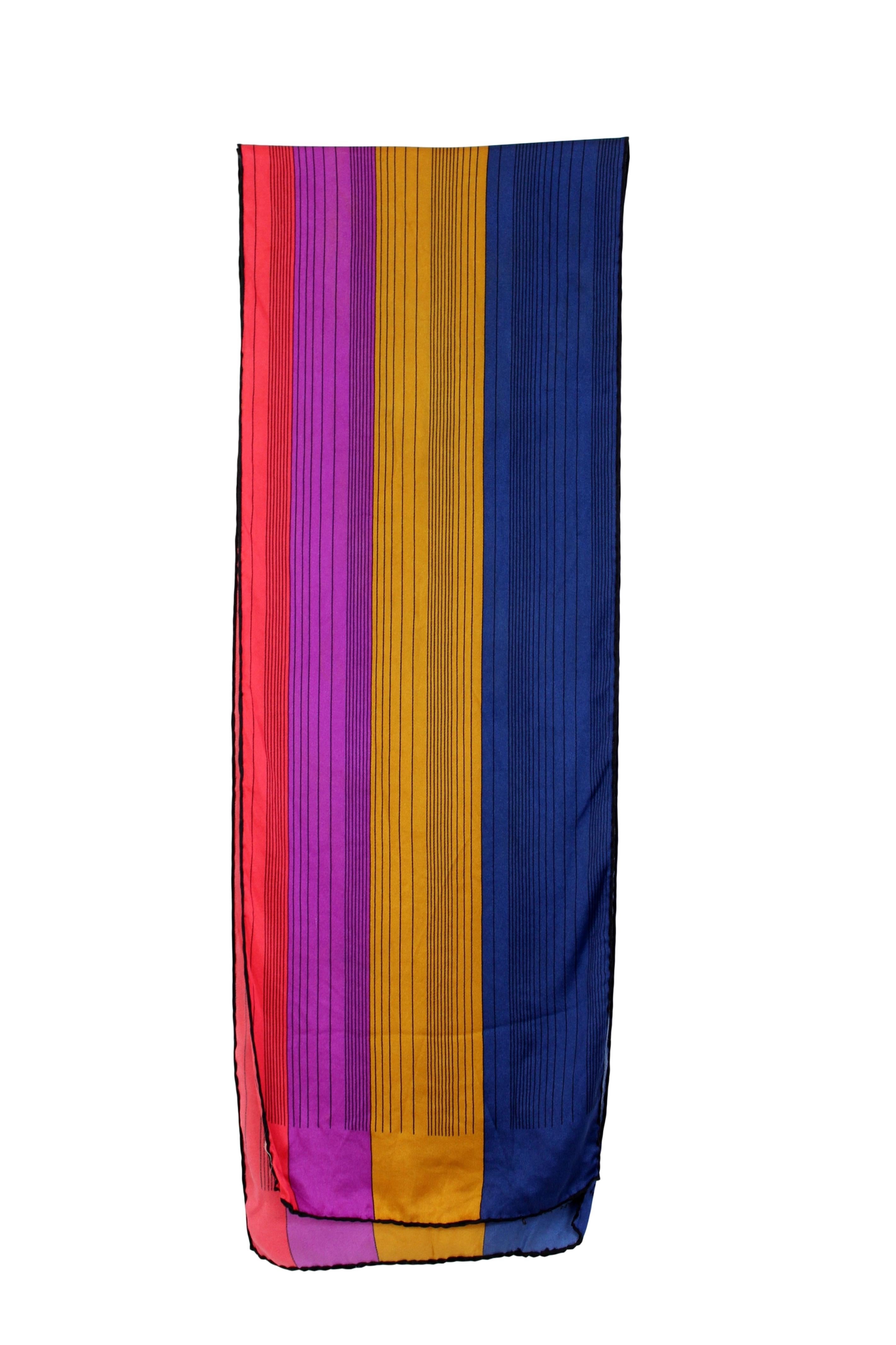 Salvatore Ferragamo vintage 90s foulard. Large stole with colored stripes, red, fuchsia and blue. Silk fabric. Made in Italy. Excellent vintage conditions.

Measures: 145 x 27 cm