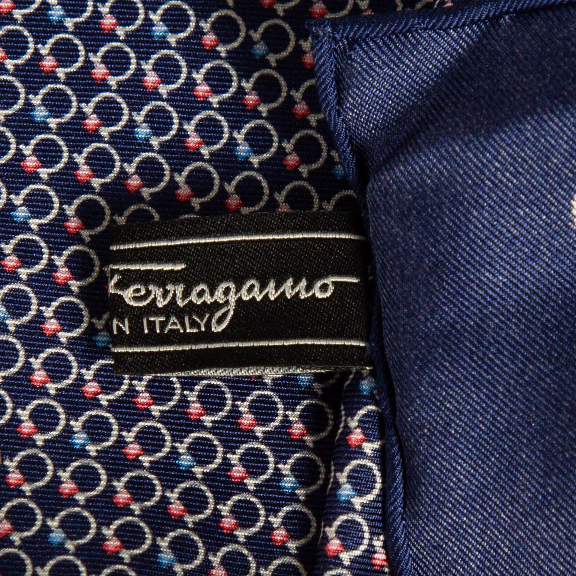 Add a touch of timeless style to your ensemble with the Salvatore Ferragamo pocket square. Crafted from luxurious silk this exquisite accessory features the iconic Gancini pattern adding a refined flair to any look. Perfect for both formal and